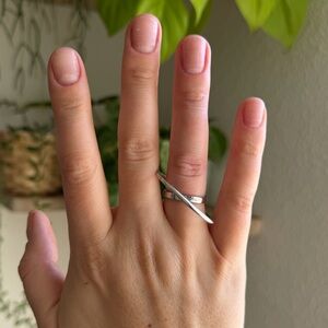 MAM silver-tone crossover ring. new with tags